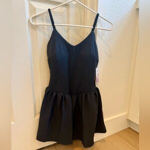 Brand new black athletic dress with built in shorts.  Size XS.